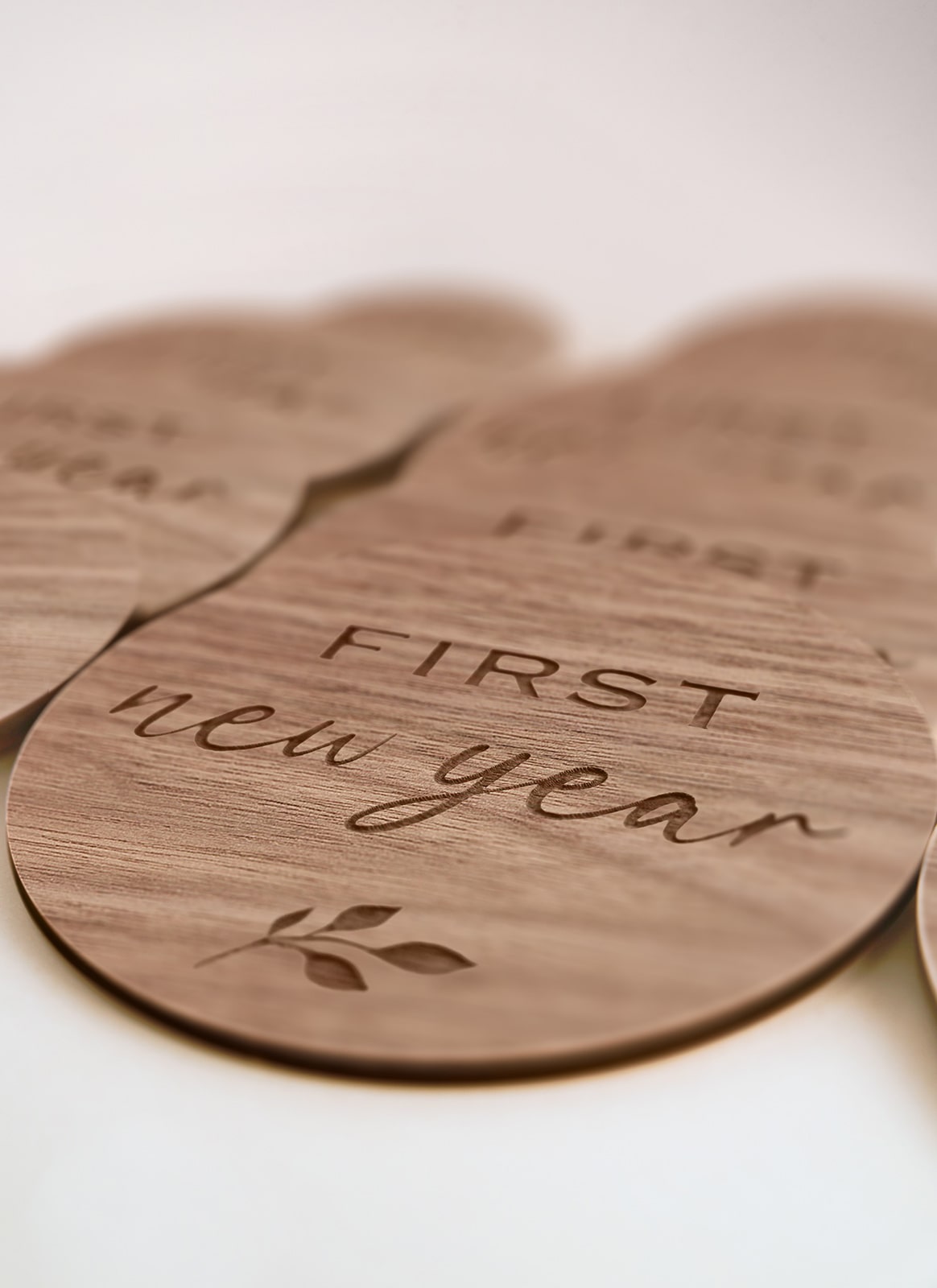 Laser cutting and engraving project using Auckland plywood supplier Plyco's 3mm American Walnut Legnoply Pack on a white background