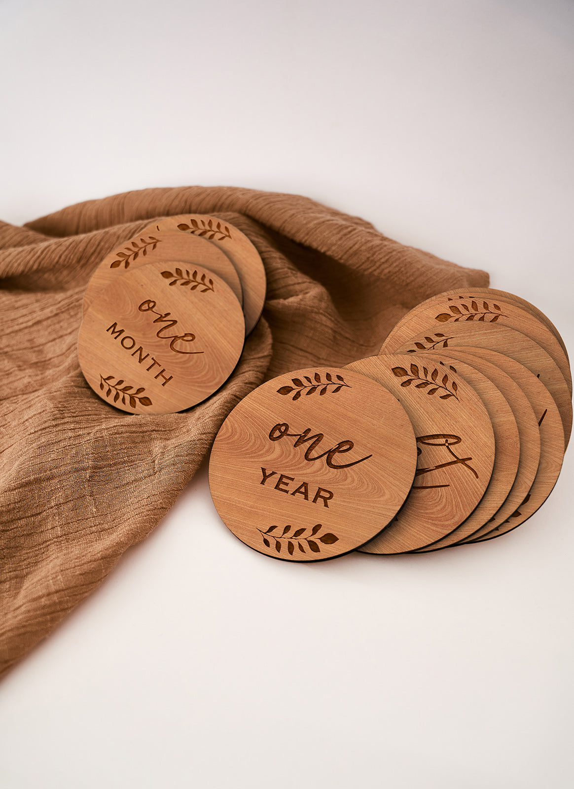 Another image of a laser cutting and engraving project with a brown cloth using Melbourne plywood supplier Plyco's 3mm Queensland Coachwood Legnoply Pack on a white background